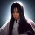 法律顾问王明哲的职业照，西装男性律师在书架前认真阅读法规文件
